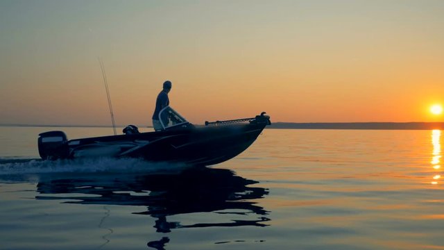 Sailing process of a fishing speedboat with two men onboard