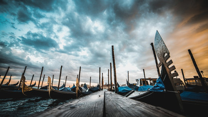 Gondolas on the dock. It's already evening, but lots of tourists