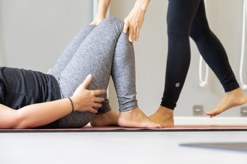 Young fat  woman practicing yoga with namaste behind the back.working out, wearing sportswear. and relax.