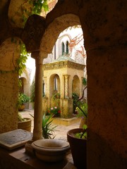 Carved Stone Gazebo in Amalfi Courtyard with Potted Plants and Archways