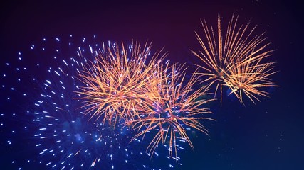 Colourful fireworks are glowing in the night sky. Happy new year concept. - Powered by Adobe