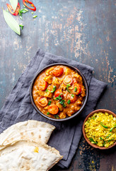 INDIAN FOOD. ROGAN JOSH curry sauce. Pork rogan josh with rice and naan bread