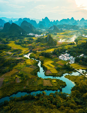 Fototapeta Aerial photo of a sunset over rice fields