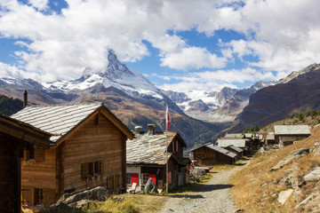 Fototapeta premium Village of Eggen with tradtional barns and sheds beneath the Matterhorn in the Swiss Alps
