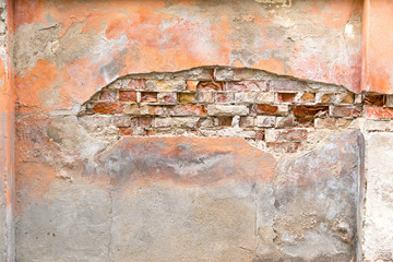 red brick wall peeling plaster