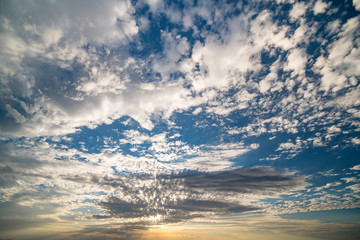 Cloudscape of morning sunlight pepping through over a Utah desert