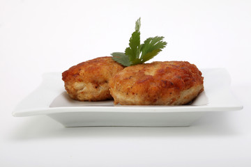 roasted pork and beef cutlets on plate