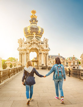 Woman Tourist Couple Friends At Zwinger Palace In Dresden, Travel Or Study In Europe Concept