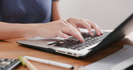 Woman work on laptop computer at home