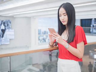 Young woman using a smartphone indoor.