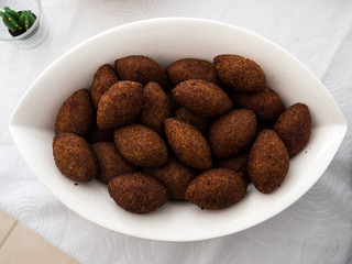 A plate with kibbe, a famous arabic food