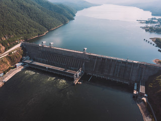 Krasnoyarsk hydroelectric station dam, hydro power plant on Enisey river from aerial view....