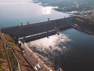 Krasnoyarsk hydroelectric station dam, hydro power plant on Enisey river from aerial view....