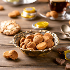 Vintage metal bowl with traditional sweets kruidnoten, pepernoten for the Dutch holiday 'Sinterklaas'. Festive concept with copy space.