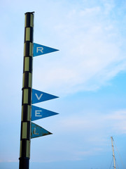 Sign post of the Port Vell (Old Port) in Barcelona, without maintenance, missing letters and with rusty plates