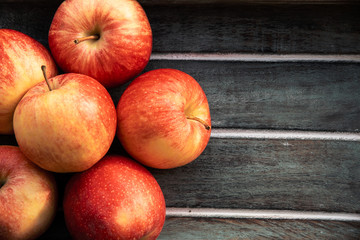 Gala apples on an wooden table