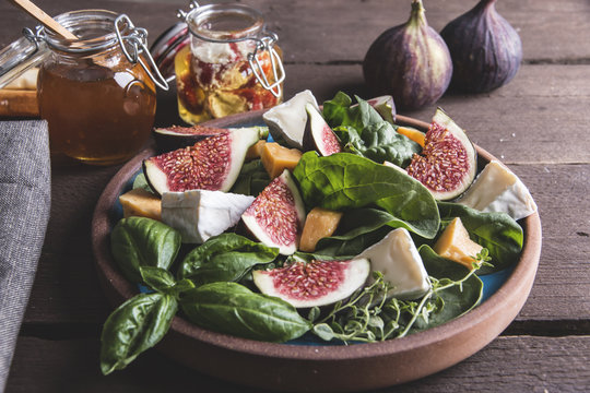 salad with green, figs, cheese vegetarian dish