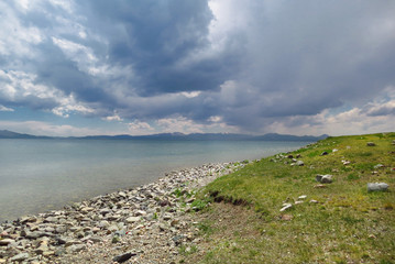 Beautiful rain clouds over the Song Kol lake