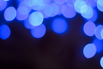 Christmas and New Year blue bokeh holidays illumination concept, empty copy space