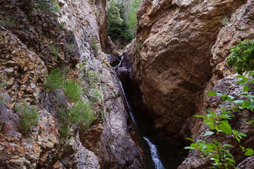 waterfall flowing down rock formations