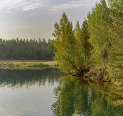 Obraz premium Artificial lake formed after the removal of sand. Closed sand quarry.