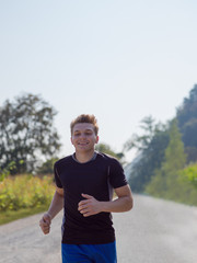 man jogging along a country road