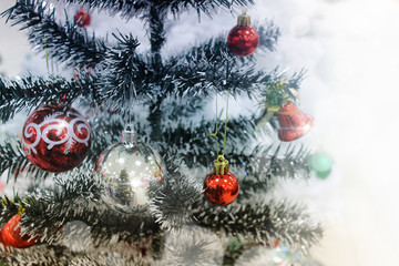 new year and christmas  background with decorated tree,toy horse and ceramic house for candle