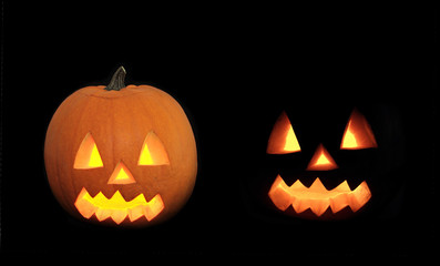 Halloween pumpkin with scary face on black background.
