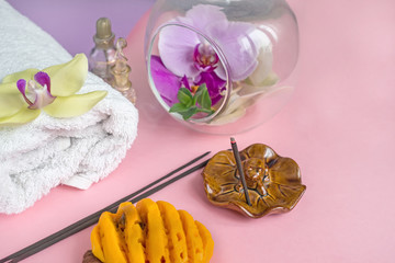 Beautiful soap in the form of flowers and towel with lavender flowers for Spa treatments on a two-tone background. Selective focus
