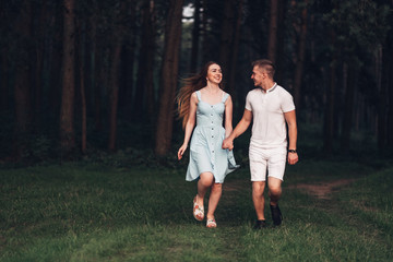 Beautiful Young Couple Have Fun at Sunset Outside of City