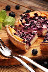 Blueberry pie or homemade cheesecake with blueberries. Delicous dessert blueberry tart
