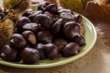 chestnut and autumn feeling, still life with chestnuts and autumn leaves.