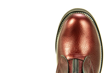A photo of a piece of shoes (cape) of blue leather female shoes, isolated on a white background.