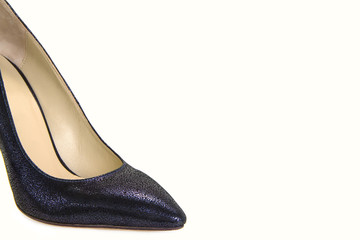 A photo of a piece of shoes (cape) of blue leather female shoes, isolated on a white background.