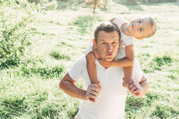 Happy Father and Son Having Fun, Enjoying Sunny Summer Day