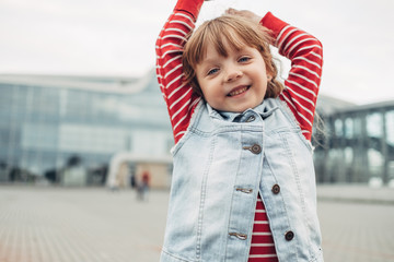 Portrait of One Little Girl Wearing Stylish Clothes Outdoors, Fashion Kid Concept