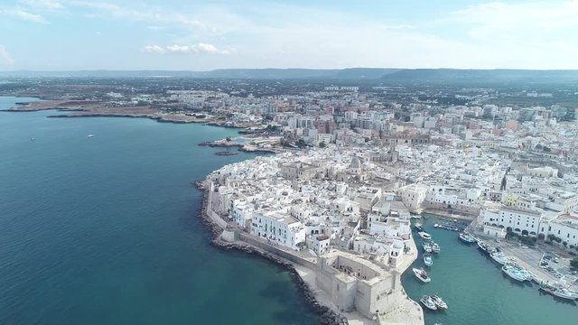 Aerial video. Old Town of Monopoli - city on Adriatic Sea. Italy. 4K