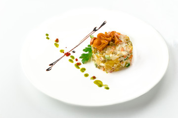 Olivier with mushrooms in a white plate, isolated on a white background. View from above, apartment.