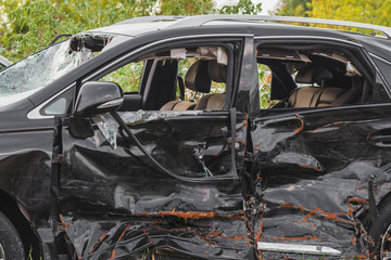 crashed doors of off-road car after the accident are on the sidelines