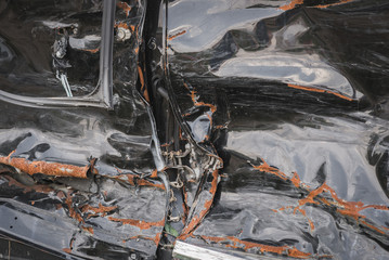 crashed doors of off-road car after the accident are on the sidelines
