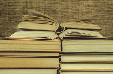 Stack of books on wooden background