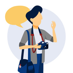 Photographer holding camera and showing ok sign.