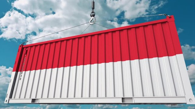 Loading cargo container with flag of Indonesia. Indonesian import or export related conceptual 3D animation