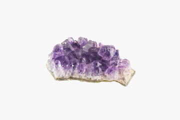 Amethyst druse isolated. Purple rough amethyst quartz crystals.