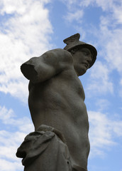 Close-up of the statue of the Greek god Hermes. Sky and clouds in the background. Este, Padua,...