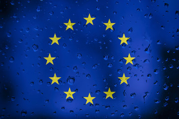 Flag of Europe on a water drops background. European Flags waterdrop texture.