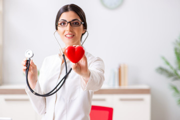 Young doctor in heart care concept