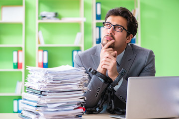 Employee chained to his desk due to workload