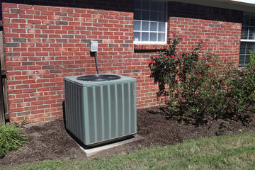 Air Conditioner system next to a home