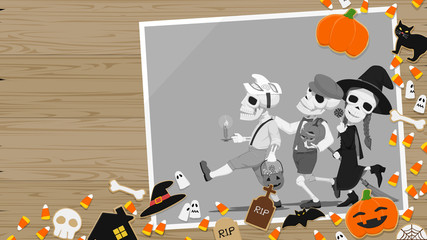 Composition of Halloween dessert and the photograph on wooden background